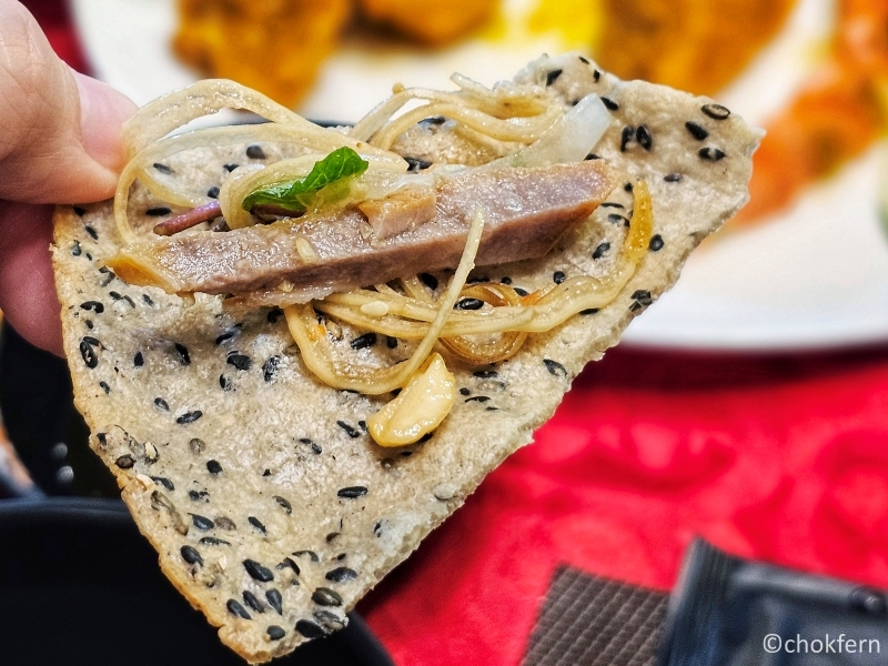 Tying out the Vietnamese way of enjoying the rice paper.