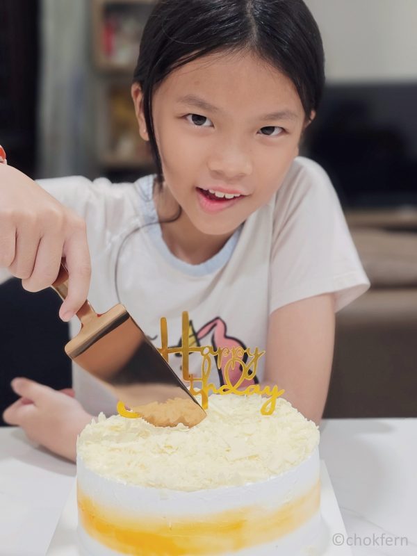 Cutting her 'belated' Birthday cake.